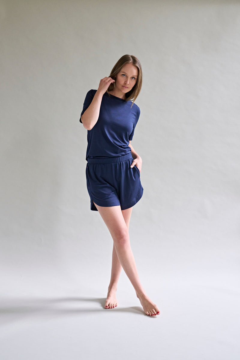 Model Stands Wearing Navy Blue Womens Merino Wool T-Shirt